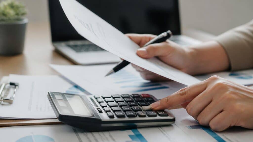Financial advisor discussing property investment options with clients at a desk